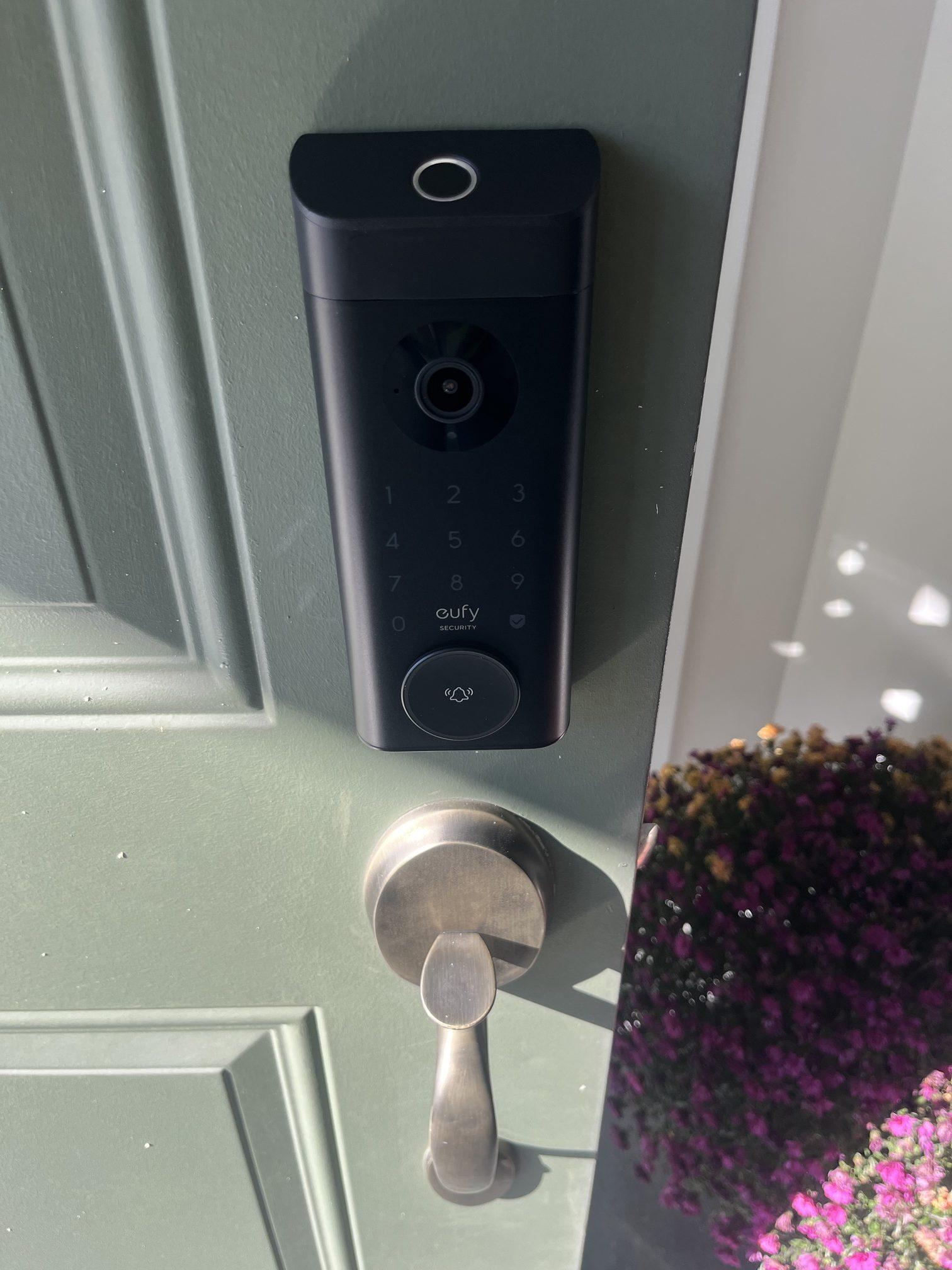 Installed eufy smart video lock with fingerprint reader, keypad and camera on residential front door