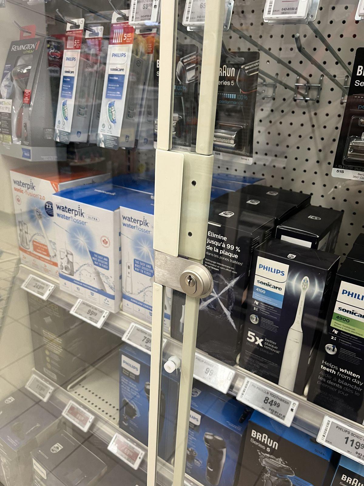 Security lock installed on a retail display cabinet