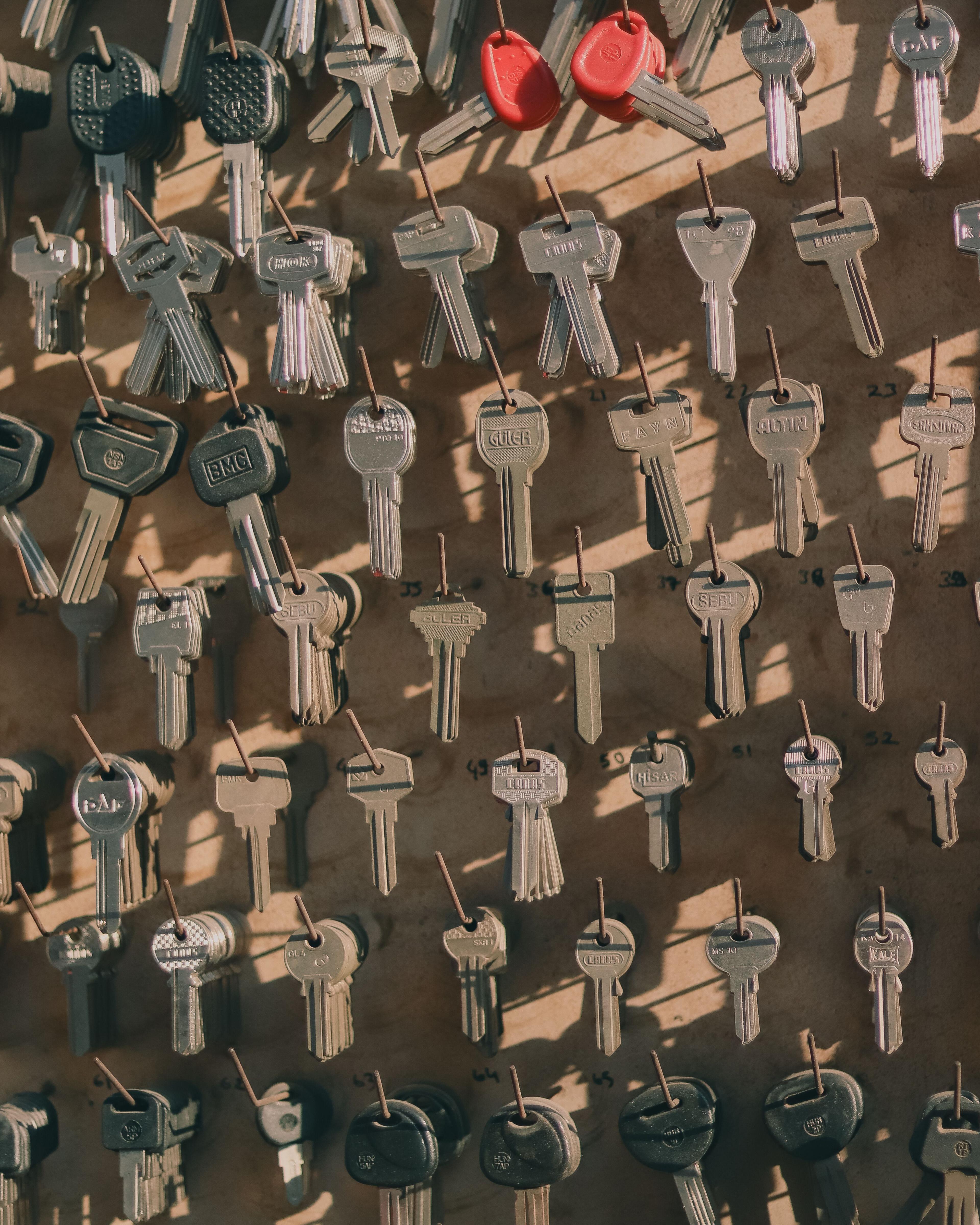 Collection of cut keys on a wall
