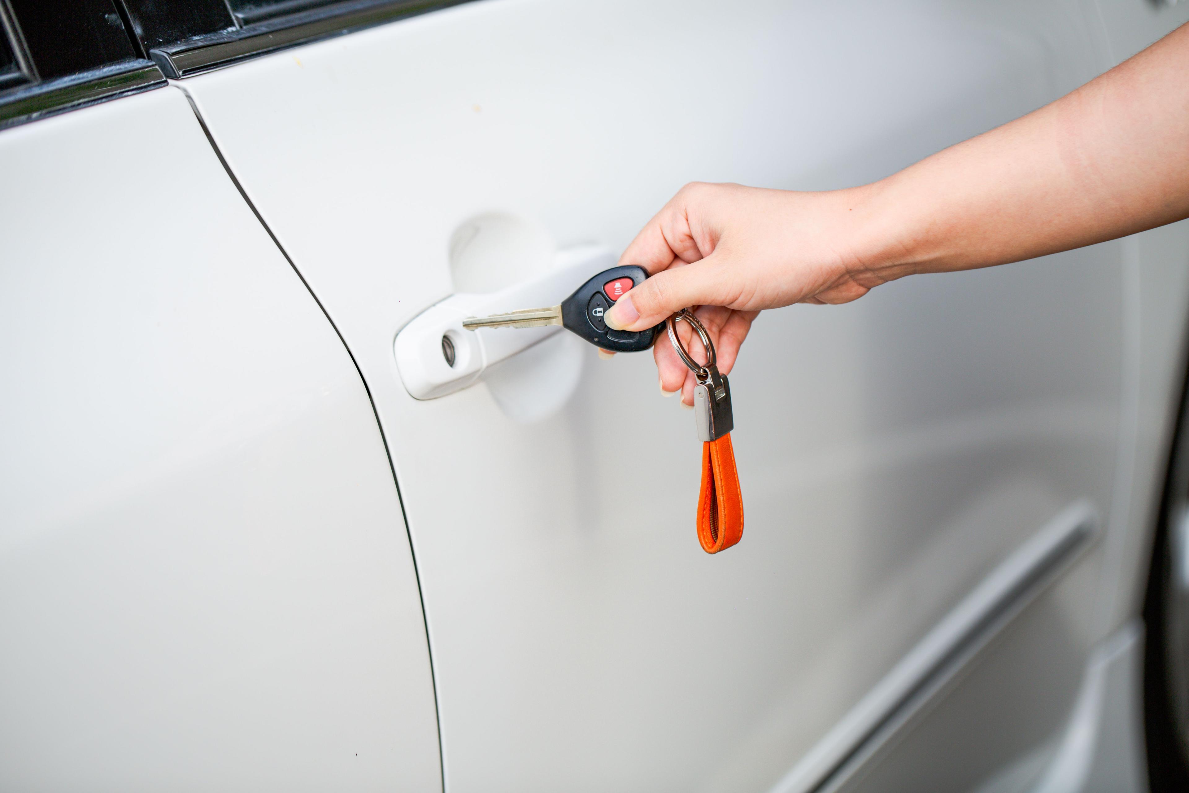 Technician unlocking a car door